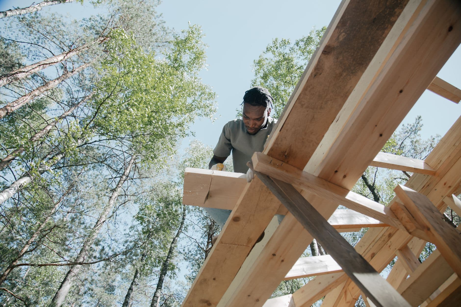 Technical builder constructing timber structure